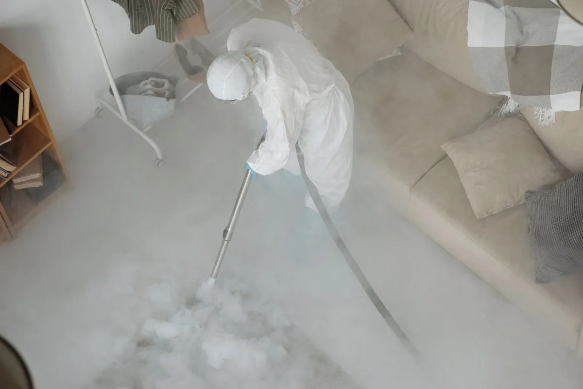 Biohazard cleanup technician in protective equipment, Olivet, NJ